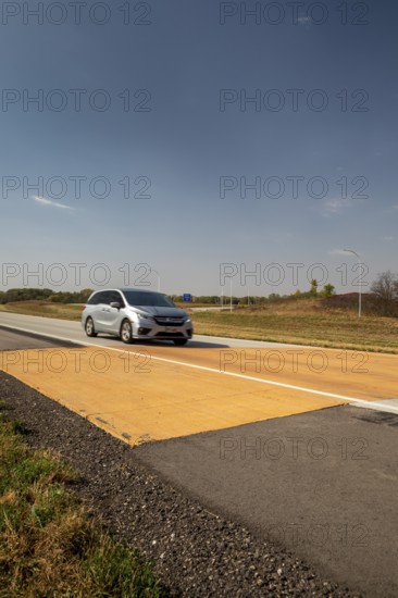 Blue Earth, Minnesota - A 'Golden Stripe' of yellow pavement marks the spot where Interstate 90 was completed in 1978. Stretching 3, 099 miles from Boston to Seattle, I-90 is the longest U.S. Interstate highway. 'Golden Stripe' recalls the 1869 'Golden Spike' of the first transcontinental railroad
