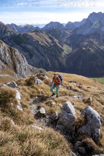 Female hiker on hiking trail, hiking to Gamsjoch, down the Ahornboden valley, eastern Karwendel, Tyrol, Austria