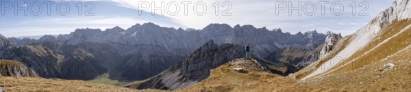 Alpine panorama, hiker on hiking trail, hiking to Gamsjoch, behind Dreizinkenspitze and Laliederer Wand, eastern Karwendel, Tyrol, Austria