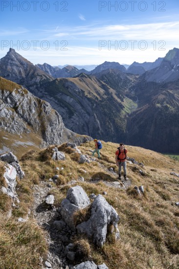 Two hikers on hiking trail, hiking to Gamsjoch, down the Ahornboden valley, eastern Karwendel, Tyrol, Austria