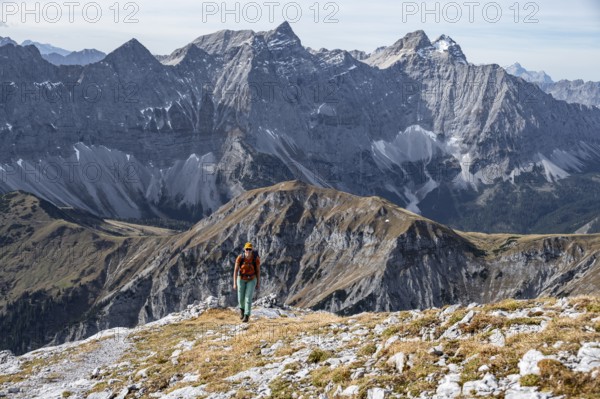 Female hiker on hiking trail, hiking to Gamsjoch, Laliderer Wand and Laliderer Spitze, eastern Karwendel, Tyrol, Austria