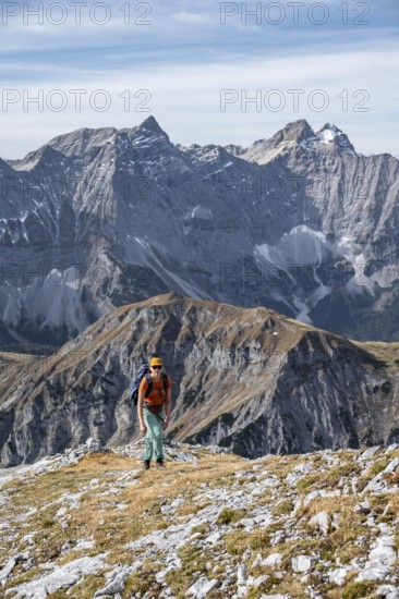 Female hiker on hiking trail, hiking to Gamsjoch, Laliderer Wand and Laliderer Spitze, eastern Karwendel, Tyrol, Austria