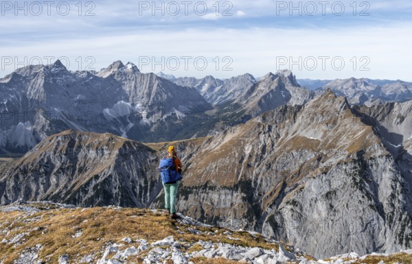 Female hiker on hiking trail, hiking to Gamsjoch, behind Laliderer Spitze, eastern Karwendel, Tyrol, Austria