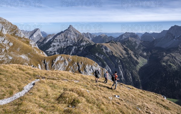 Three hikers on hiking trail, hiking to Gamsjoch, eastern Karwendel, Tyrol, Austria