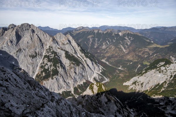 Extensive view of valleys and mountain ranges under blue skies, eastern Karwendel, Tyrol, Austria