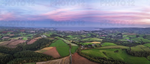 Twilight Sky of Torbay farms and fields from a drone, Totnes, Berry Pomeroy, Devon, England, United Kingdom
