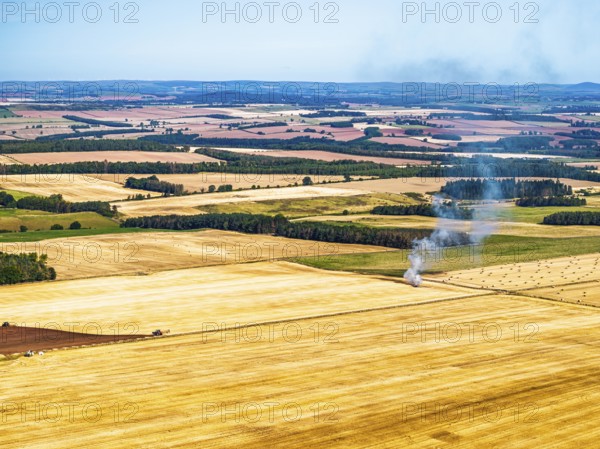 Scottish fields over Waterloo Monument from a drone, Jedburgh, Scotland, UK