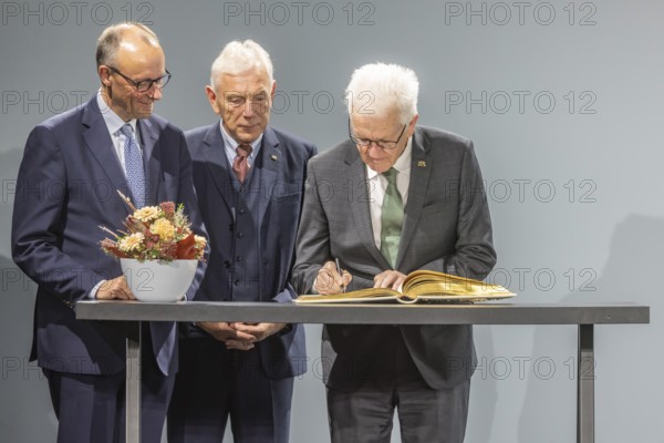 Entry in the Golden Book of the City of Heilbronn: Federal Chancellor Friedrich Merz, Lord Mayor Harry Mergel, Winfried Kretschmann, Minister-President BW. ground-breaking ceremony ceremony for the Artificial Intelligence Innovation Park (IPAI) . Heilbronn, Baden-Württemberg, Germany