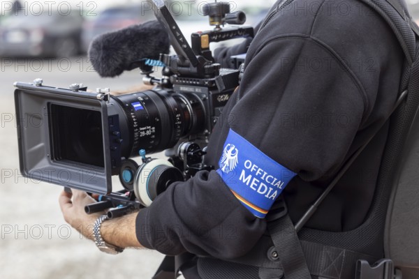 Cameraman at an event with the Federal Chancellor. The journalists wear an armband with the federal coat of arms and the inscription OFFICIAL MEDIA. ground-breaking ceremony ceremony for the Artificial Intelligence Innovation Park (IPAI) . Heilbronn, Baden-Württemberg, Germany