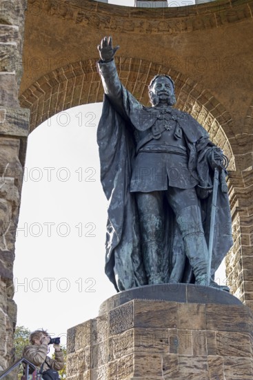 Woman photographed, statue, Kaiser Wilhelm Memorial, Porta Westfalica, North Rhine-Westphalia, Germany