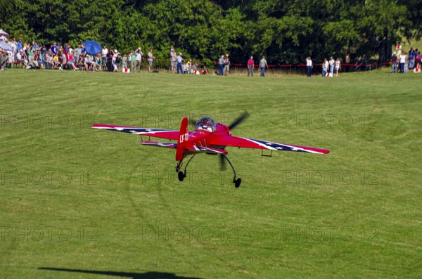 A Soviet Jakovlev Jak-55 sport aircraft with the registration LY-TOY during a flight demonstration as part of an air show on Rossfeld in Metzingen-Glems, Baden-Württemberg, Germany, for editorial use only