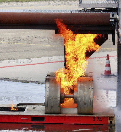 Stuttgart Airport Fire Department is practicing emergencies on a state-of-the-art simulator. Emergency service extinguish fire