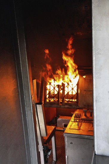 Stuttgart Airport Fire Department is practicing emergencies on a state-of-the-art simulator. Emergency service extinguish fire Cockpit