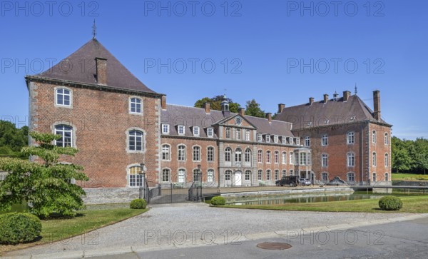 16th century Classicist Château de Franc-Waret in Louis XV style, moated castle in the village Fernelmont, province of Namur, Wallonia, Belgium