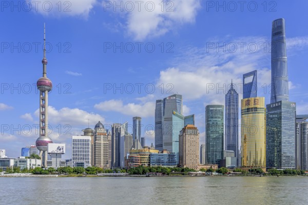 Huangpu River and Lujiazui skyline with skyscrapers, Shanghai Tower and Oriental Pearl Tower in financial district of Pudong at city Shanghai, China