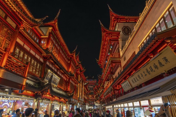 Yuyuan Tourist Mart, formerly Yuyuan Shopping Mall in the Old Street illuminated at night in the Huangpu District in the city Shanghai, China