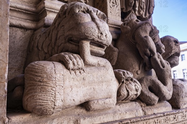 Lion eating man, sculpture at St. Trophime Cathedral portal, Arles, France