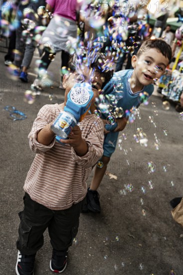 Soap bubbles, kids, boys, Arles, France