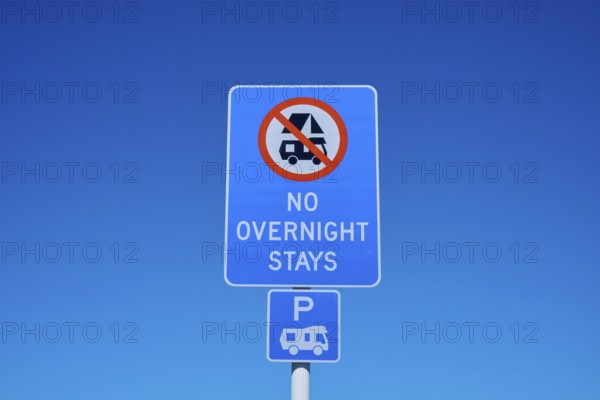 Road sign banning camping under clear blue sky, Lake Pukaki Viewpoint, Pukaki, Canterbury, South Island, New Zealand