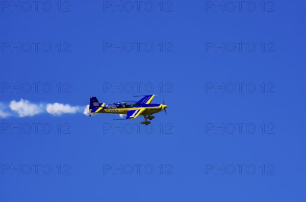 An Extra EA-300 from Extra Flugzeugproduktions- und Vertriebs GmbH with registration D-EXBH during a flight demonstration as part of an air show on Rossfeld in Metzingen-Glems, Baden-Württemberg, Germany, for editorial use only