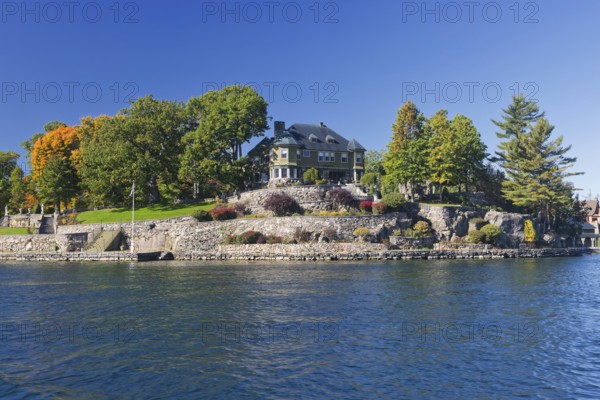 House on a small island in the Saint Lawrence River, 1000 Islands Park, on the borderline the Province of Ontario Canada and the US-American side