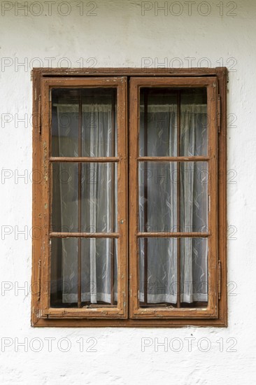 Brown wooden frame with curtains in a white house, Weinviertel Lower Austria Austria
