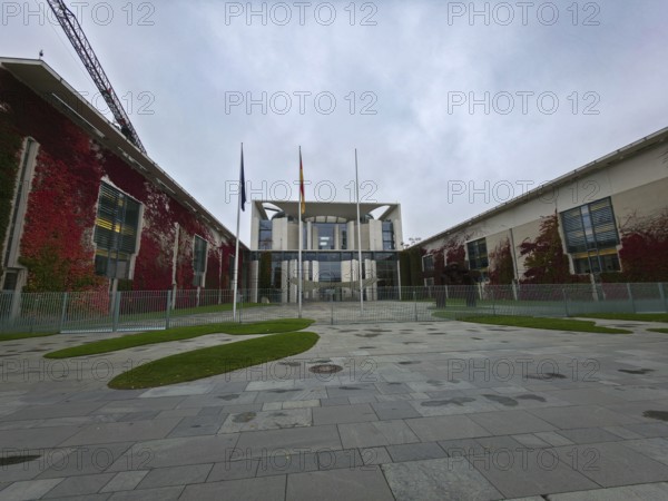 The Federal Chancellery, modern government building with glass and red climbing plants on a silent, grey day, government district in 10557 Berlin, Germany