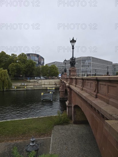 The Moltke Bridge, historic bridge across the Spree with wrought-iron chandelier, flanked by modern architecture, government district in 10557 Berlin, Germany