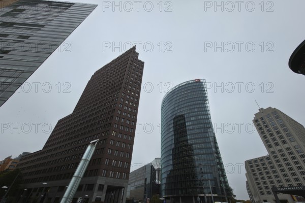 Wide-angle view of the skyscrapers on Potsdamer Platz under a cloudy sky, at Potsdamer Platz in 10785 Berlin, Germany