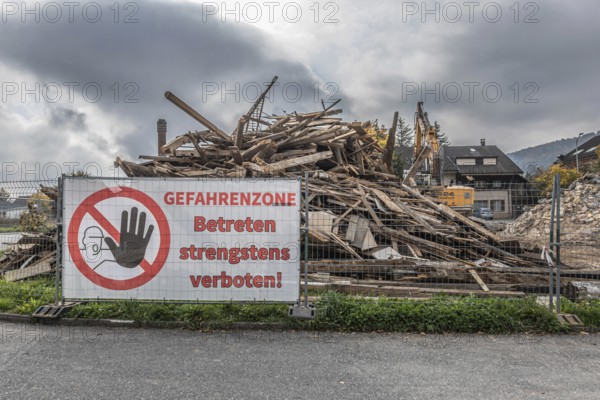 Large construction site banner, entry into danger zone strictly prohibited! Demolition of a high-studhouse built in 1710 in Reinach, Aargau, Switzerland
