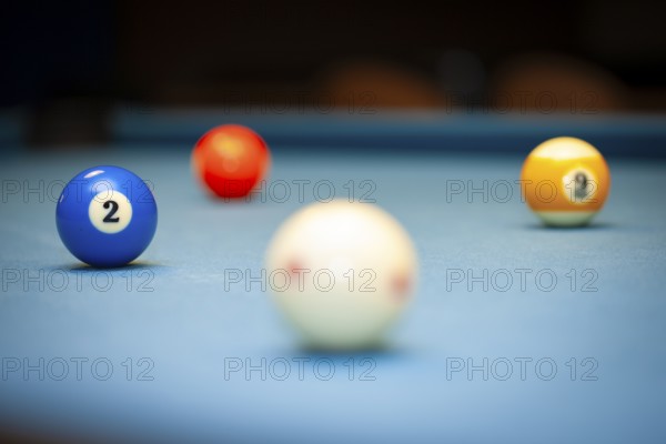 Four balls on a pool pool table