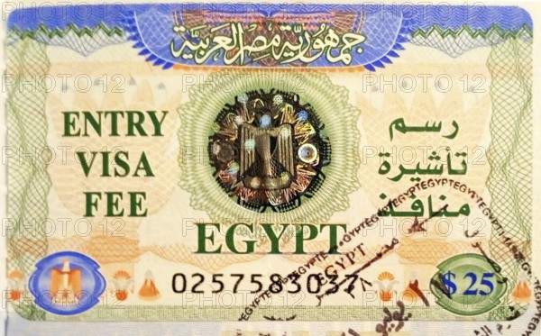 Tourist visa with stamp for entry to mainland Egypt, pasted into the passport at the airport of Ophira (Ras Nasrani) .This visa helps travelers from all over the world to migrate freely and move from the Sinai Peninsula (Western Asia) to the African part of the country without restrictions. South Sinai. Sharm el-Sheikh, Egypt