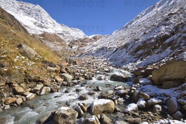 High alpine landscape with a stream of meltwater in South Tyrol, Italy