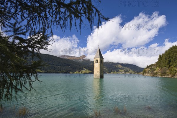 The church tower standing in Lake Reschen is the bell tower of the former parish church of St. Katharina in Graun in Vinschgau, Italy. The church was consecrated in 1357 and demolished and flooded with other buildings in the summer of 1950