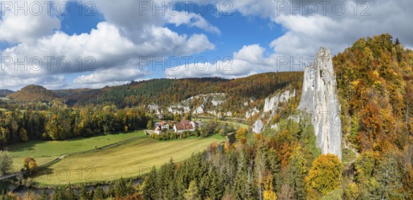 Aerial view, panorama of Käppeler estate with the St. George's Basilica near Thiergarten in the upper Danube Valley, surrounded by autumn vegetation, on the right the raven rocks, climbing rocks, Jura limestone rocks, Sigmaringen district, Baden-Württemberg, Germany