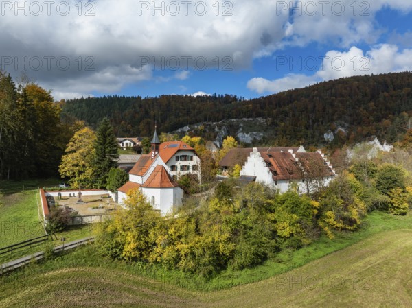 Aerial view of Käppeler Manor with St. George's Basilica near Thiergarten in the Upper Danube Valley, surrounded by autumn vegetation, Sigmaringen district, Baden-Württemberg, Germany
