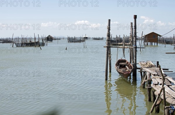 Thailand, Songkhla, Koh Yo, Aquacultural farm, Freshwater fish farming, Long-tailed boat out of water