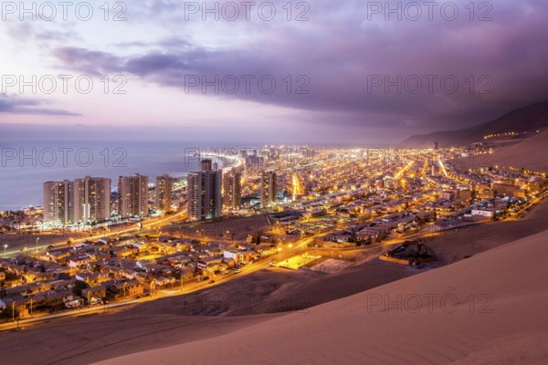 City of Iquique at dusk viewed from Cerro Dragon. Iquique, Tarapaca Region, Chile. 19.11.15