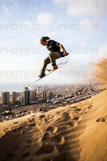 Sandboarding in Cerro Dragon, in Atacama Desert. Iquique, Tarapaca Region, Chile. 19.11.15