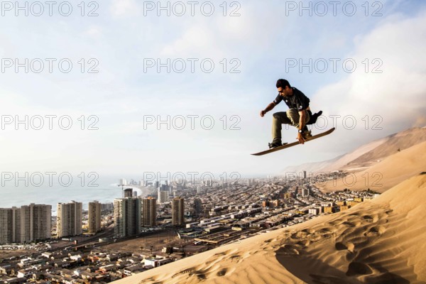 Sandboarding in Cerro Dragon, in Atacama Desert. Iquique, Tarapaca Region, Chile. 19.11.15