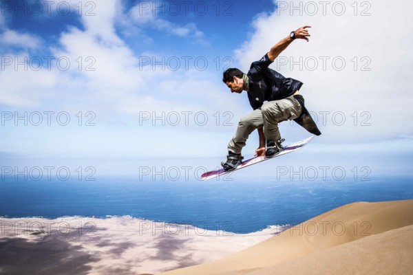 Sandboarding in Alto los Verdes, in Atacama Desert. Iquique, Tarapaca Region, Chile. 19.11.15