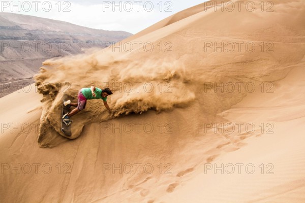 Sandboarding in Cerro Dragon, in Atacama Desert. Iquique, Tarapaca Region, Chile. 18.11.15