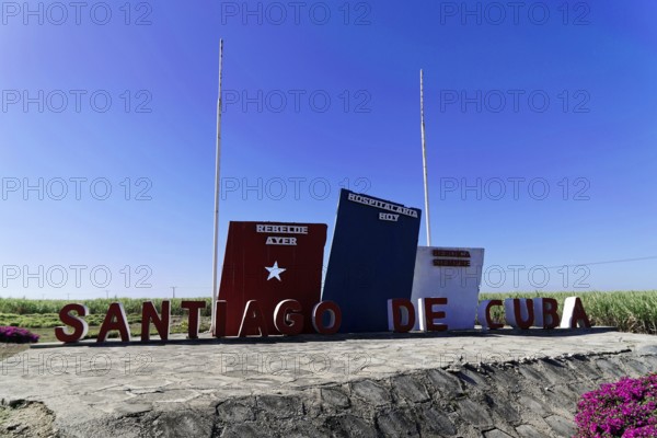 Blue sky sign 'Santiago de Cuba' in front of the countryside, Cuba, Greater Antilles, Caribbean, Central America, America, Central America