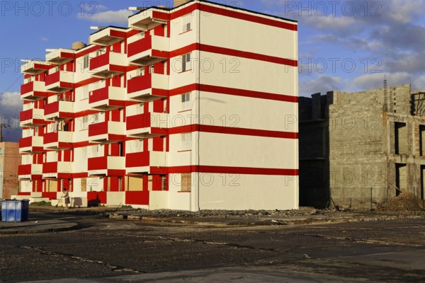 Baracoa, Cuba, Central America, modern high-rise building with eye-catching red and white color scheme in the building area, Greater Antilles, Caribbean, America, Central America