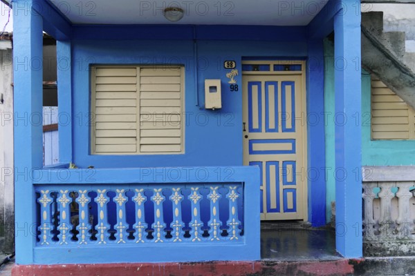 Baracoa, Cuba, Central America, Blue House with pastel colored doors, modern balcony and closed shutters, Greater Antilles, Caribbean, America, Central America