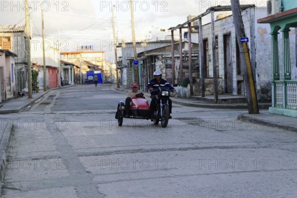 Baracoa, Cuba, Central America, morning scene in quiet street with motorcycle team and sidecar, Greater Antilles, Caribbean, America, Central America
