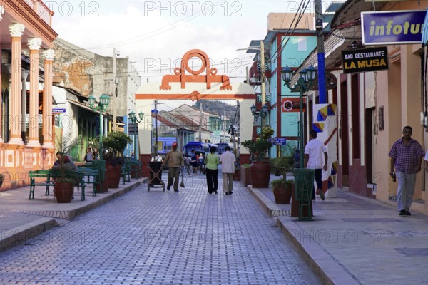 Baracoa, Cuba, Central America, Busy street with many people and colorful colonial buildings, Greater Antilles, Caribbean, America, Central America