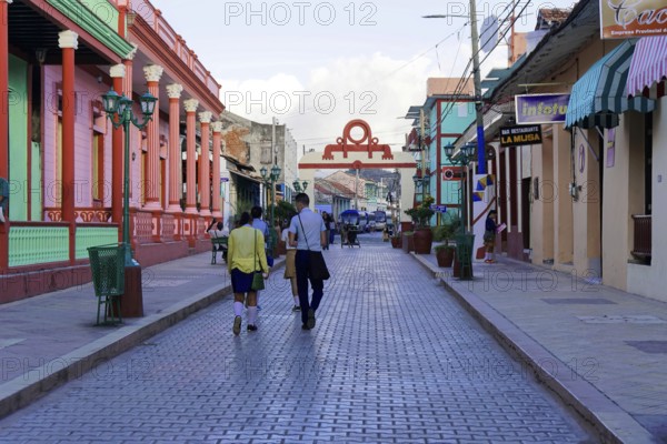 Baracoa, Cuba, Central America, people walking on a street lined with colonial buildings, Greater Antilles, Caribbean, America, Central America