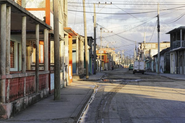 Baracoa, Cuba, Central America, Deserted street with empty sidewalks and visible old buildings, Greater Antilles, Caribbean, America, Central America