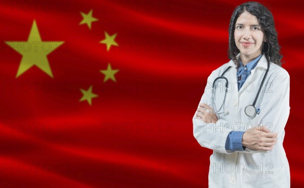 Chinese medicine and healthcare concept. Close up of doctor against China flag background